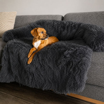 Calming Couch Bed in Dark Grey draped over a sofa cushion
